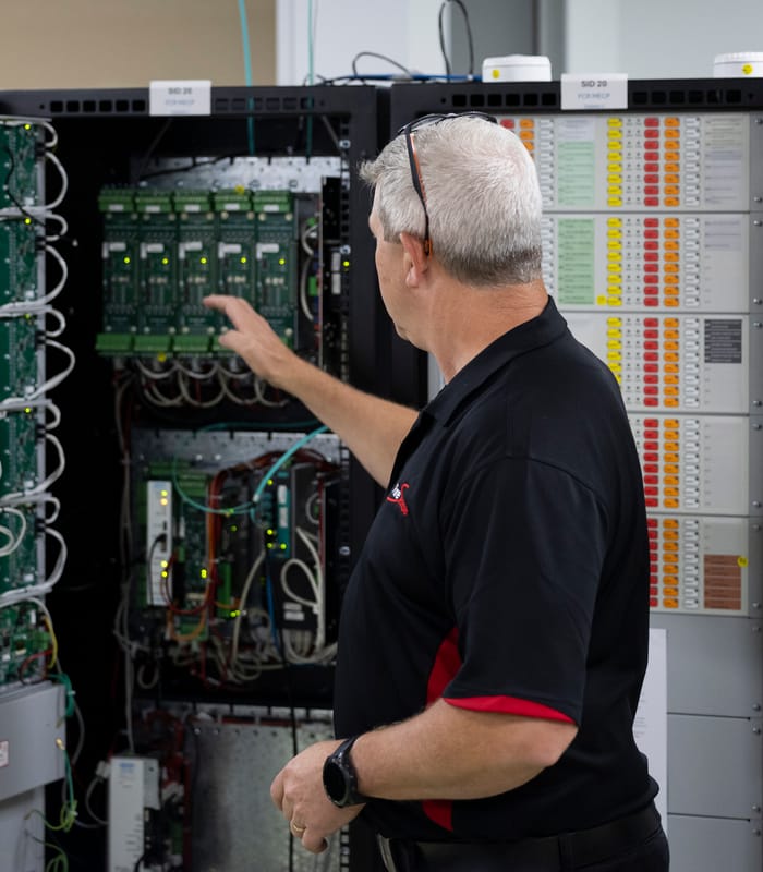A person working on a electrical panel