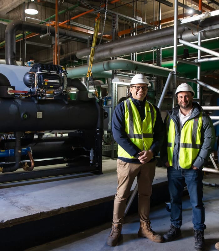 Men in front of machinery